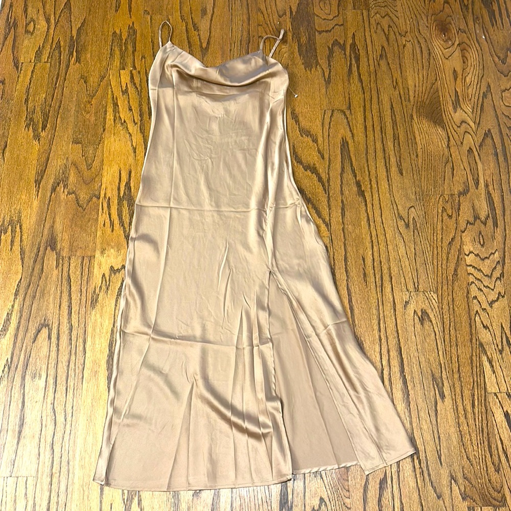 Never worn, tags still on, bronze slip dress with scoop neck and slit